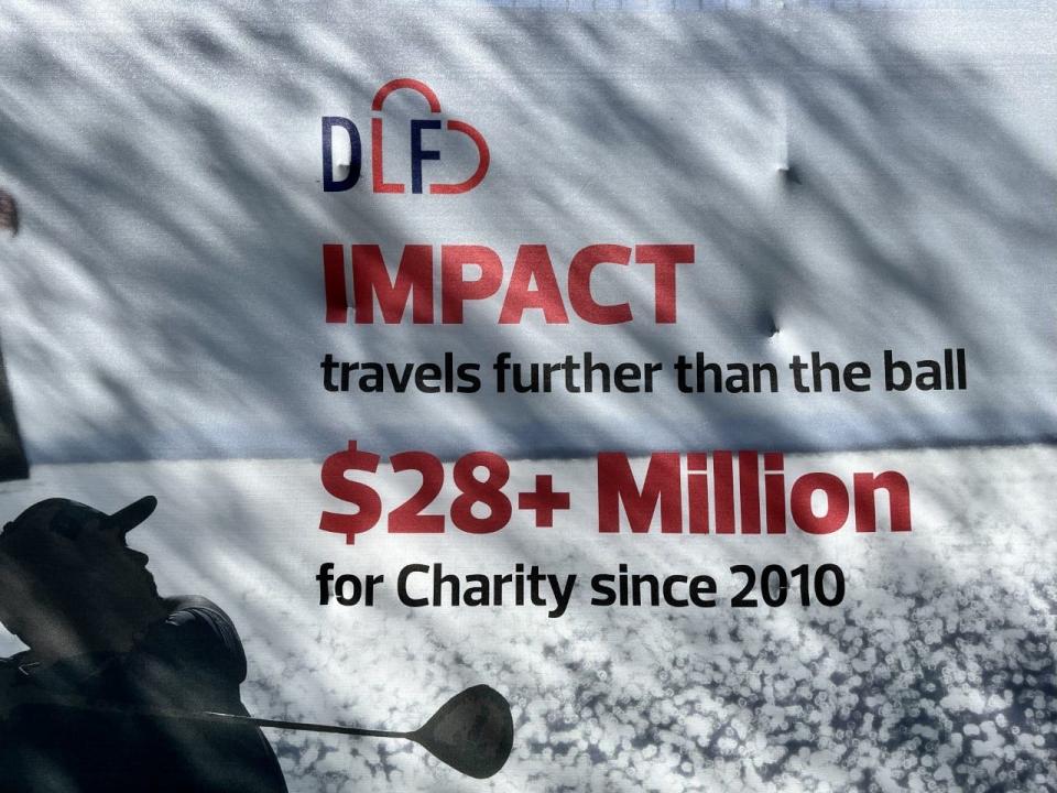 A sign at the RSM Classic at the Sea Island Club Seaside Course display the amount raised for charity in the first 12 years of the tournament. The figure is projected to climb past $35 million this year.