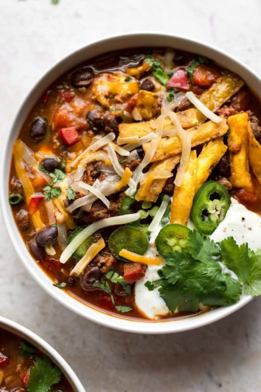 <p>Salt & Lavender</p><p>This black bean chili is super versatile because you can load it up with your family's favorite toppings. </p><p><strong>Cost: $18.41</strong></p><p><strong>Get the recipe: <a href="https://www.saltandlavender.com/easy-black-bean-chili/" rel="nofollow noopener" target="_blank" data-ylk="slk:Easy Black Bean Chili;elm:context_link;itc:0;sec:content-canvas" class="link rapid-noclick-resp">Easy Black Bean Chili</a></strong></p>