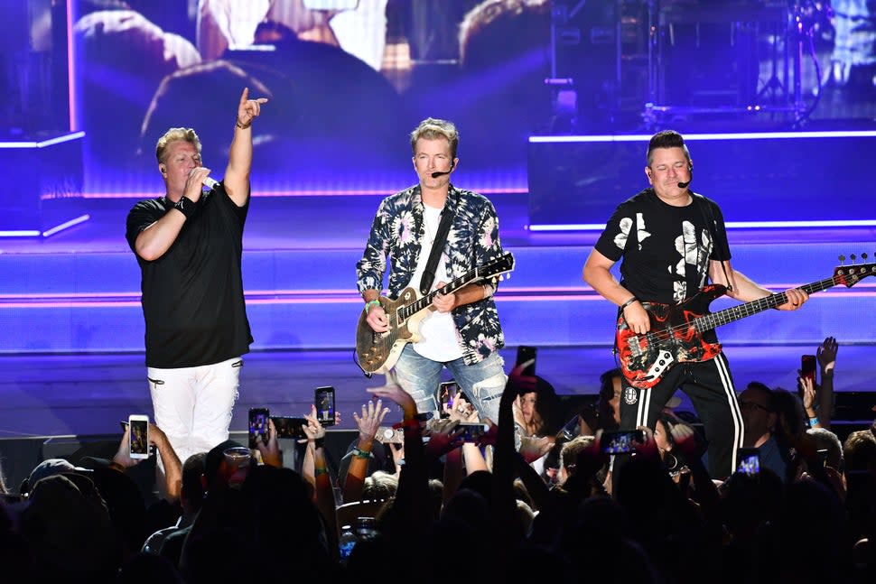 (L-R) Singers Gary LeVox, Joe Don Rooney, Jay DeMarcus of the band Rascal Flatts performs onstage at FivePoint Amphitheatre on August 01, 2019 in Irvine, California.