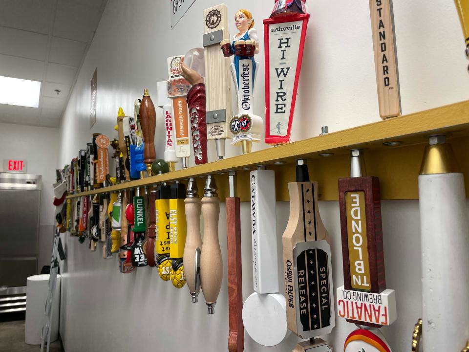 The Admiral Pub has countless varieties of craft beers, each with its own decorative tap handle that can be installed when the beer is on tap.