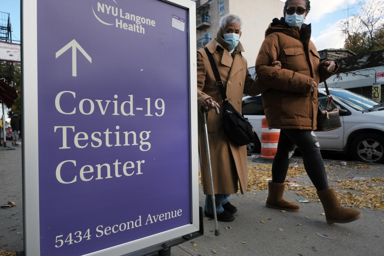 A sign outside a hospital in New York City points to a COVID-19 testing center.