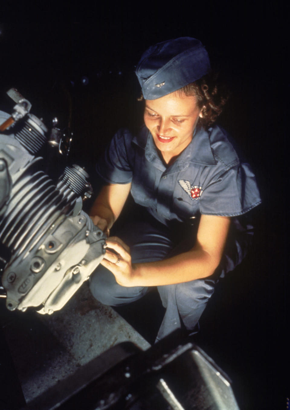 Mechanic Mary Josephine Farley working on a Wright Whirlwind motor in the Assembly and Repairs Department at Naval Air Station, Corpus Christi, Texas, in 1942.