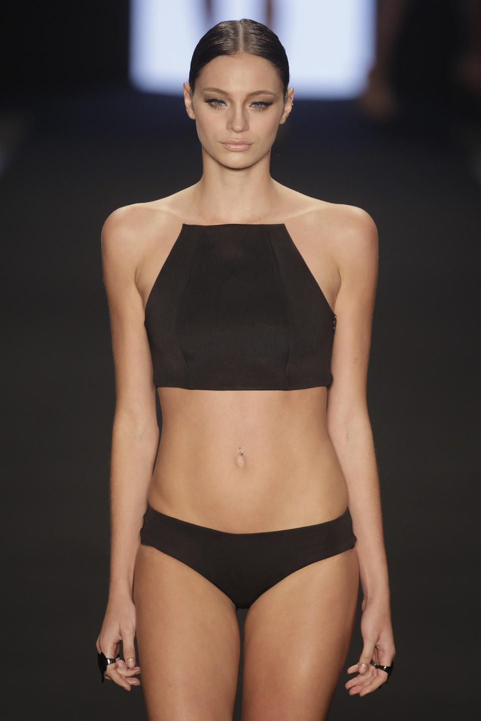 A model wears a creation from the Lenny summer collection during Fashion Rio in Rio de Janeiro, Brazil, Wednesday, April 17, 2013. While still almost alarmingly itsy-bitsy by American standards, Lenny's bikinis are less revealing than most bikinis in Brazil, and less flashy and cutesy than the bubblegum pink offerings of many local swimwear labels. (AP Photo/Felipe Dana)