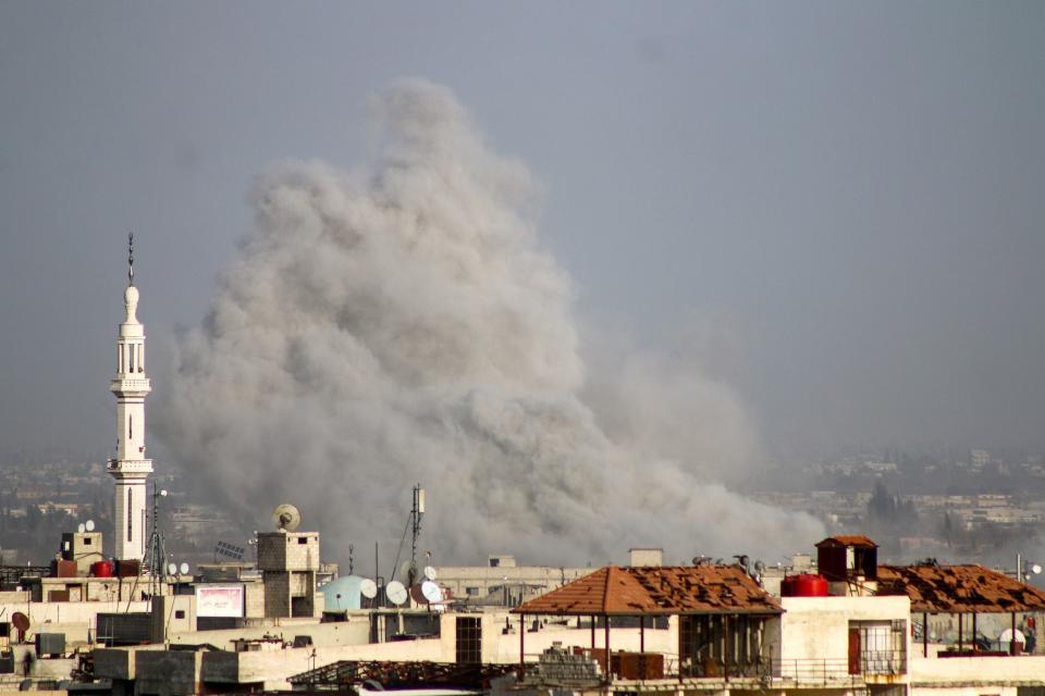 Smoke rises over Kafr Batna on Friday. (Photo: Ammar Al-Bushy/Anadolu Agency via Getty Images)