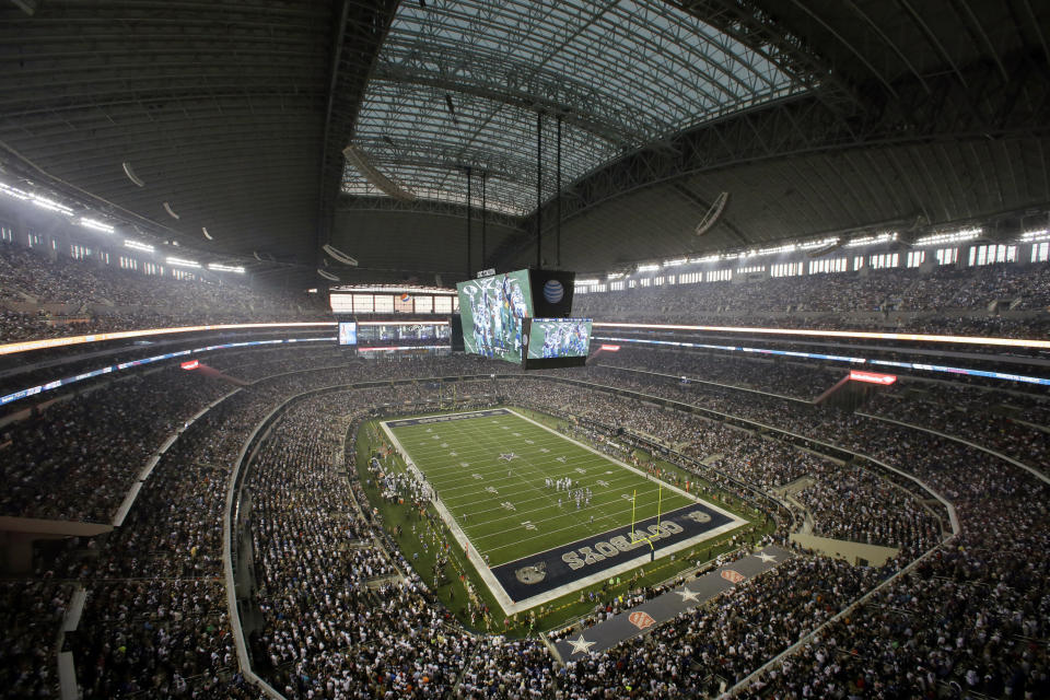 FILE - Fans watch at the start of an NFL football game inside AT&T Stadium between the New York Giants and Dallas Cowboys, Sunday, Sept. 8, 2013, in Arlington, Texas. The NFL, not surprisingly in the midst of a rise in COVID-19 cases, has looked into other potential sites for next month's Super Bowl. AT&T Stadium in Arlington, Texas, the home of the Dallas Cowboys, reportedly is one of the facilities contacted.(AP Photo/Tony Gutierrez, File)