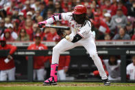 Cincinnati Reds third baseman Elly De La Cruz (44) attempts to lay down a bunt during the second inning of an opening day baseball game against the Washington Nationals in Cincinnati, Thursday, March 28, 2024. (AP Photo/Timothy D. Easley)