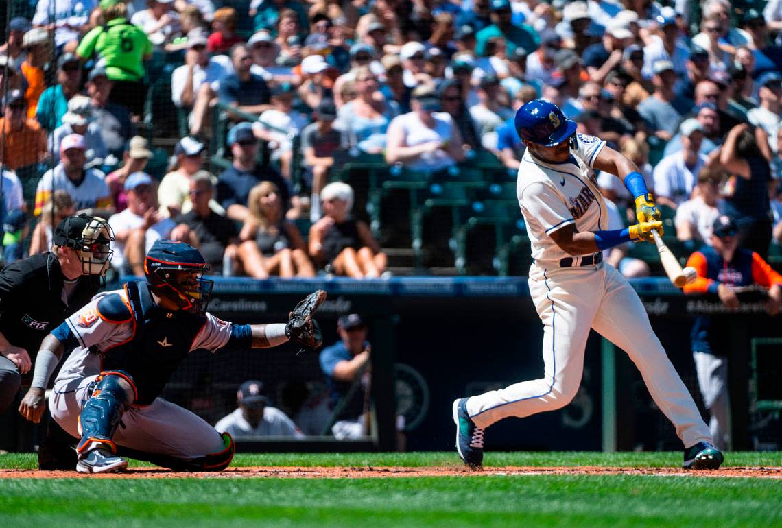 Seattle Mariners designated hitter Kyle Lewis (1) hits the ball during fourth inning of the game at T-Mobile Park on Sunday, July 24, 2022 in Seattle, Wash. The Astros defeated the Mariners 8-5.