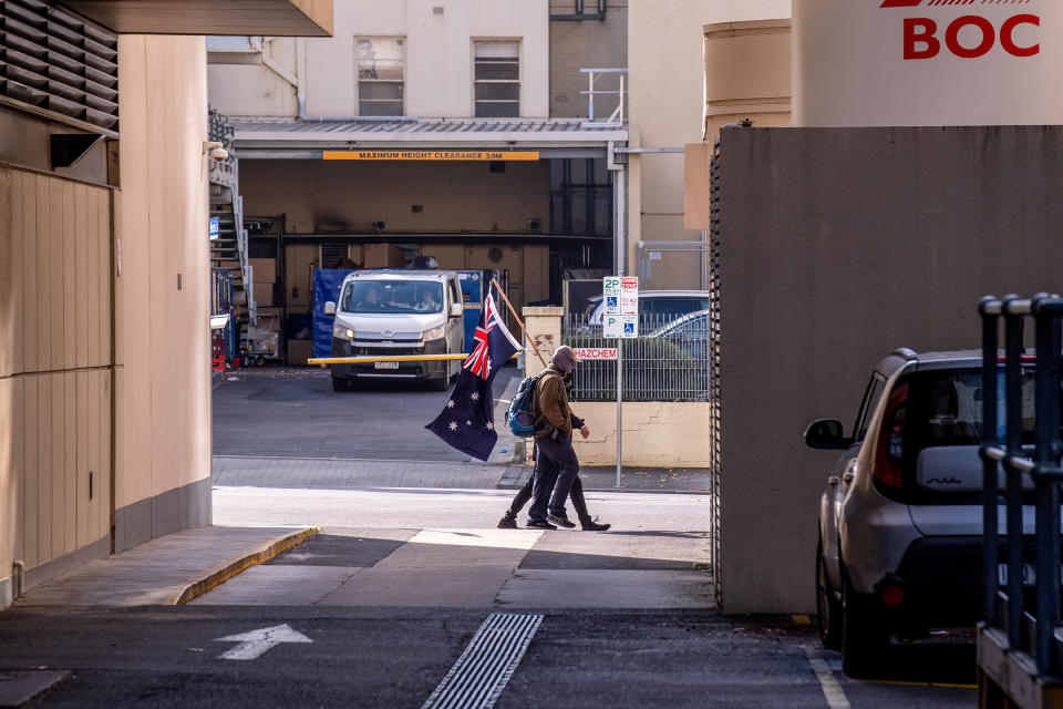 Two Neo-Nazis walk away after being ordered to leave by police during an anti-immigration rally at state parliament in Melbourne on May 13.<span class="copyright">Michael Currie—Speed Media/Shutterstock</span>