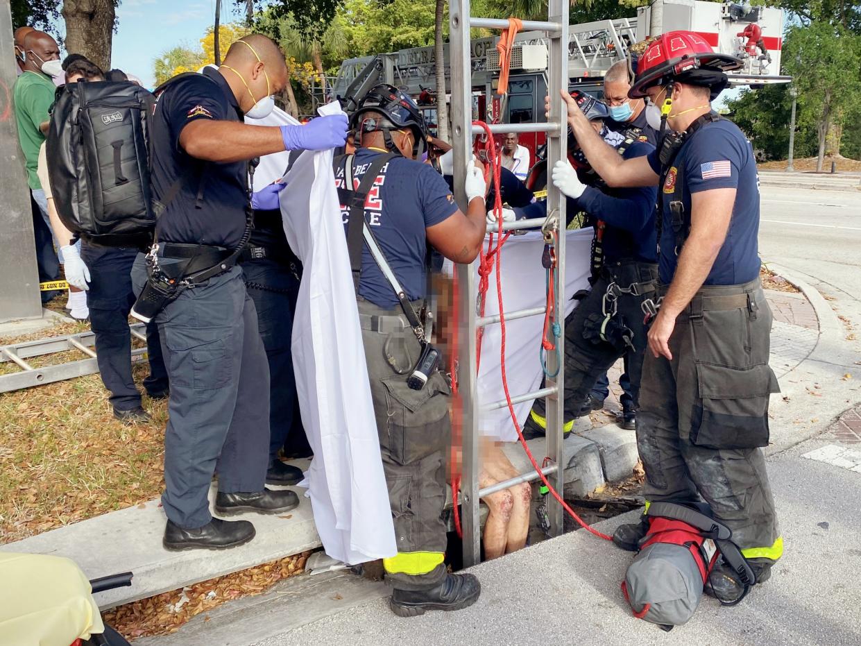 <p>Image from the scene as firefighters rescued Lyndsey Kennedy from the storm drain</p> ((Delray Beach Fire Rescue))