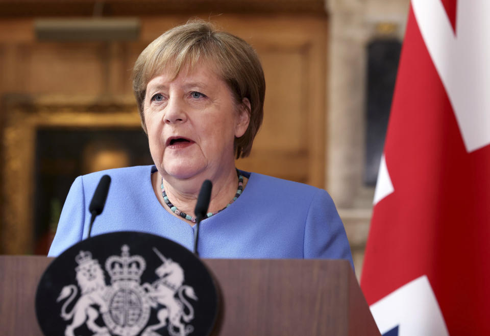 German Chancellor Angela Merkel, takes part in a press conference with Britain's Prime Minister Boris Johnson, after their meeting at Chequers, the country house of the Prime Minister, in Buckinghamshire, England, Friday July 2, 2021. Johnson is likely to push Angela Merkel to drop her efforts to impose COVID-19 restrictions on British travelers as the German chancellor makes her final visit to Britain before stepping down in the coming months. Johnson will hold talks with Merkel at his country residence on Friday. (Jonathan Buckmaster//Pool Photo via AP)