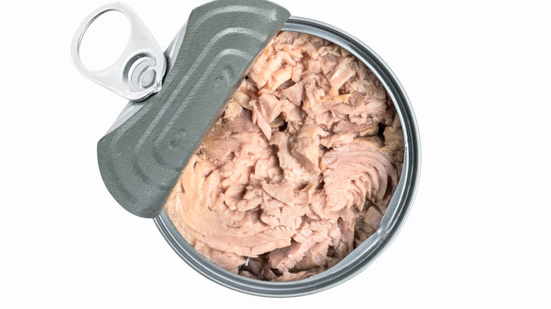 can of chunk tuna with lid peeled over
