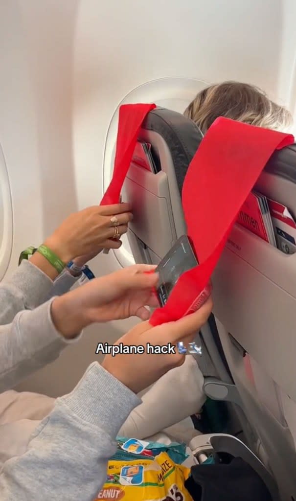 In the 10-second TikTok, Augusta boards a Norwegian Airlines flight with her friend. As they walk toward their seats, Augusta flips the headrest cover on the seat in front of her so it hangs behind the seat, facing hers. TikTok/@idaaugusta