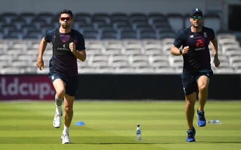 England bowler James Anderson (l) takes part in a fitness run with Phil Scott during England nets ahead of the Test Match against Ireland - Credit: Getty Images