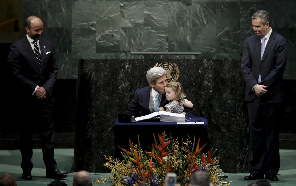 Image: Secretary of State John Kerry kisses his two-year-old granddaughter after signing the Paris Agreement on climate change at United Nations.  (Mike Segar / Reuters)