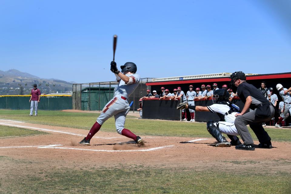 Oaks Christian's Finley Buckner takes a mighty cut during the Lions' 8-6 win at Rio Mesa in CIF-SS Division 3 first-round game on Friday, May 6, 2022.