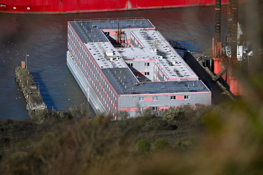 WEYMOUTH, ENGLAND - FEBRUARY 26: An elevated view of the Bibby Stockholm immigration barge in Portland Port, on February 26, 2024 in Weymouth, England. The Mayor of Portland,  Carralyn Parkes, is challenging the Home Office's jurisdiction over the asylum-seeker barge, the Bibby Stockholm. Parkes believes the barge should be subject to planning control by Dorset Council, giving local residents a say in the decision to dock it at Portland Port. (Photo by Finnbarr Webster/Getty Images)