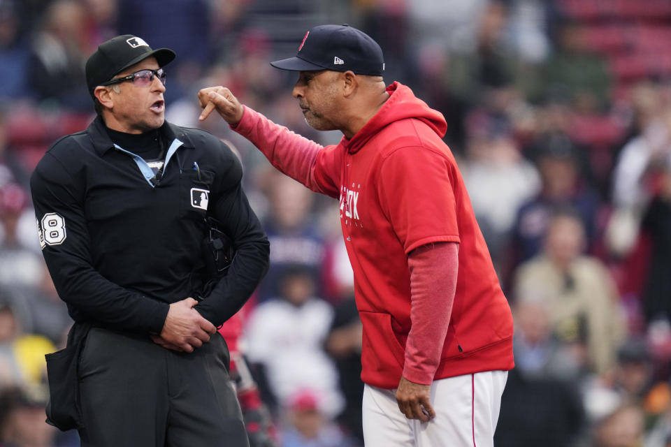 Boston Red Sox manager Alex Cora, right, argues with umpire Chris Guccione, left, at the top of the ninth inning of a baseball game against the Tampa Bay Rays at Fenway Park, Monday, June 5, 2023, in Boston. Cora was ejected from the game. (AP Photo/Charles Krupa)