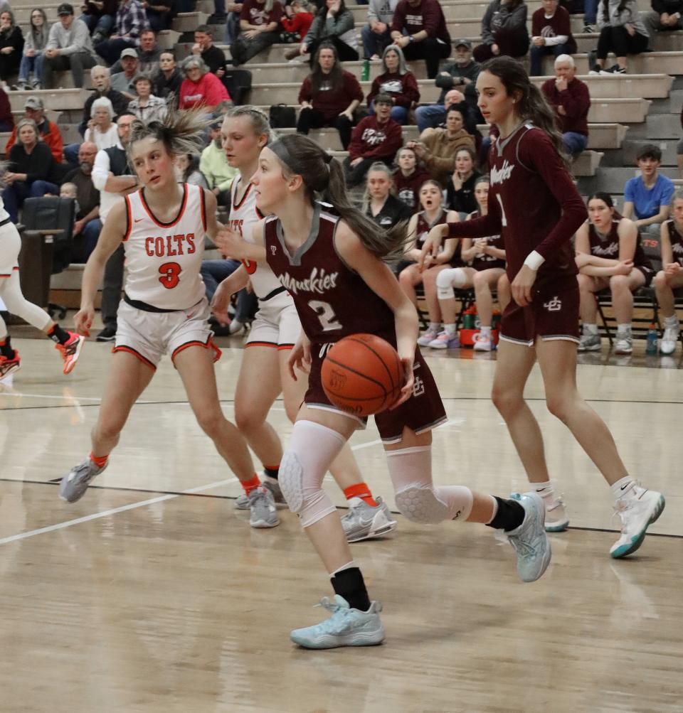 John Glenn's Mya Oliver (2) dribbles the ball during the girls basketball game at Meadowbrook High School. The Muskies were voted the second seed in Division II as the East District held its tournament draw on Sunday.