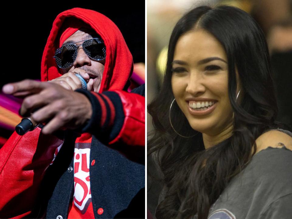 A composite of Nick Cannon holding a microphone close to his mouth and pointing while wearing a red hoodie and Bre Tiesi smiling while wearing large hoop earings.