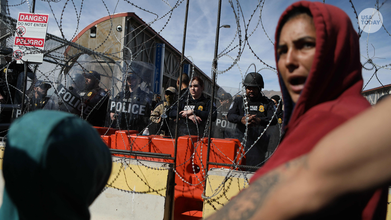 TOPSHOT - Migrants, mostly of Venezuelan origin, attempt to forcibly cross into the United States at the Paso del Norte International Bridge in Ciudad Juarez, Chihuahua state, Mexico, on March 12, 2023. - Hundreds of migrants, mostly Venezuelans, attempted to stampede across one of the border bridges in the northern Mexican city of Ciudad Juarez, desperate to gain asylum in the United States. (Photo by HERIKA MARTINEZ / AFP) (Photo by HERIKA MARTINEZ/AFP via Getty Images) ORG XMIT: 1885 ORIG FILE ID: AFP_33B42ZZ.jpg