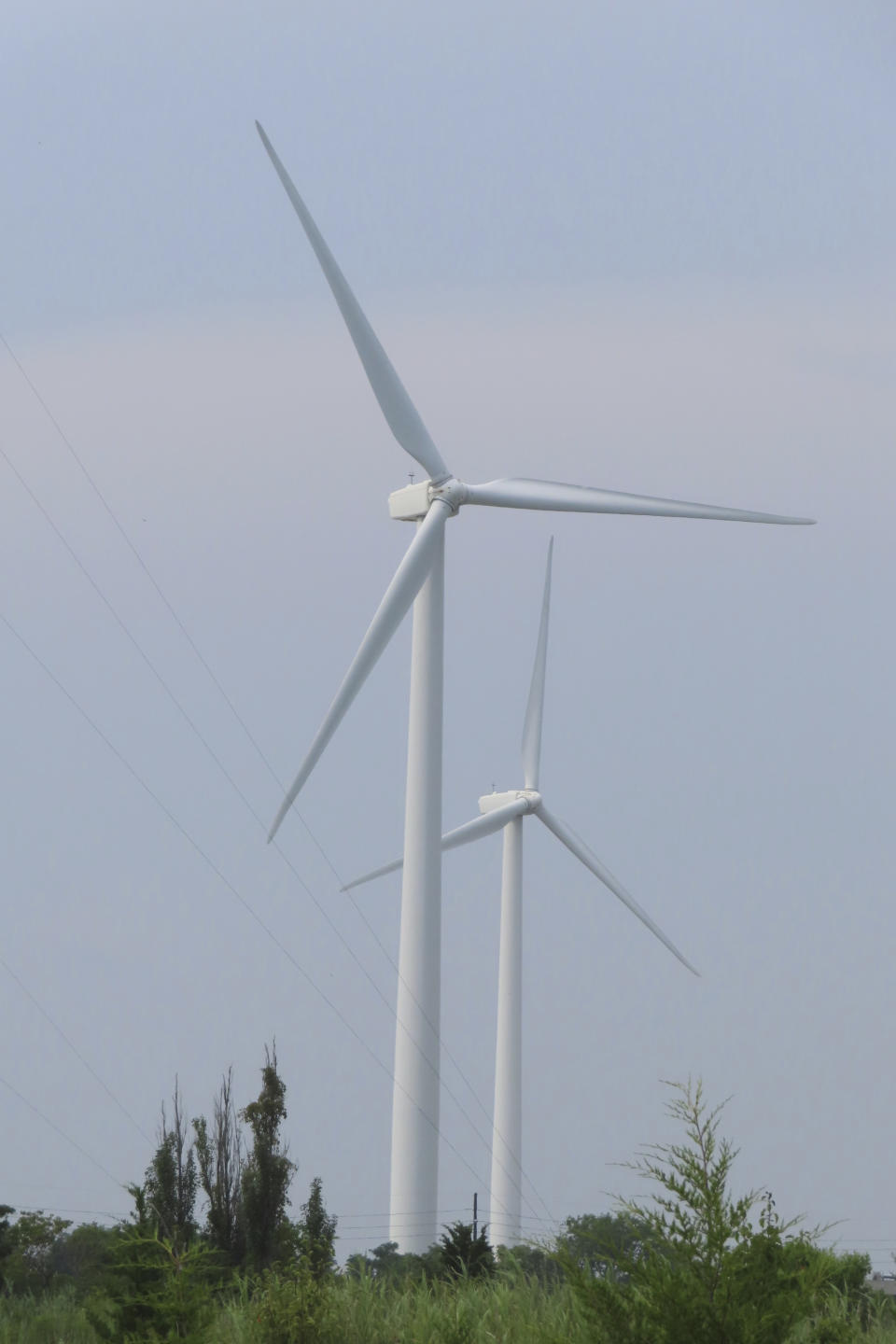 Land-based wind turbines spin in Atlantic City N.J. on July 20, 2023. Wind developer Orsted scrapped the project on Oct. 31, 2023, citing supply chain problems and high interest rates. (AP Photo/Wayne Parry)