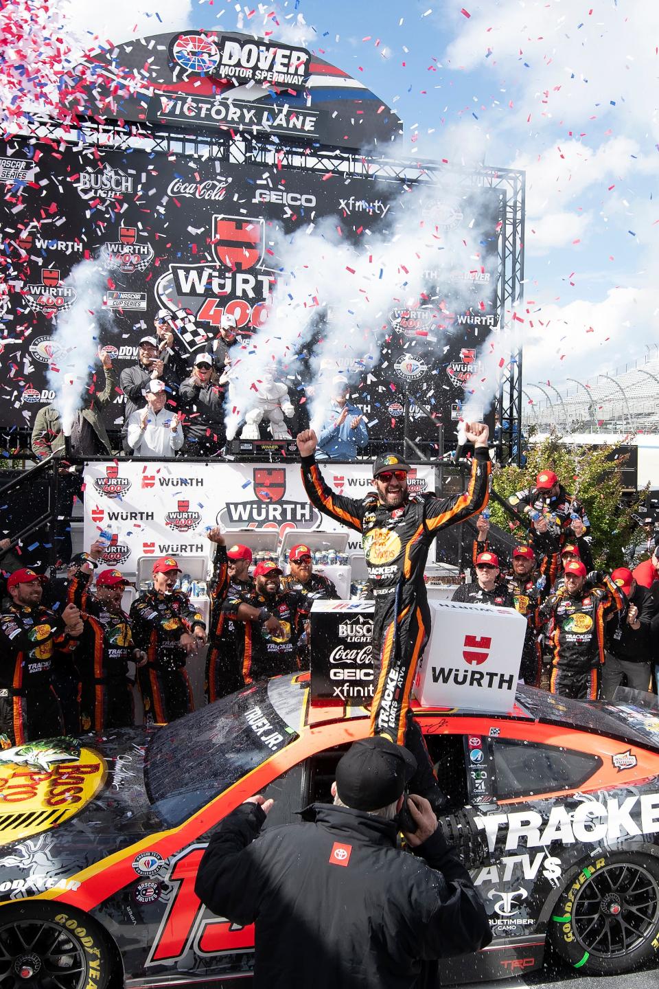 Martin Truex Jr., center, celebrates in Victory Lane after winning the NASCAR 400 auto race at Dover Motor Speedway Monday, May 1, 2023, in Dover, Del. (AP Photo/Jason Minto)
