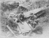 <p>Canadian soldiers enjoy a game of cards in a shell hole on Vimy Ridge in April 1917. Photo from Library and Archives Canada. </p>