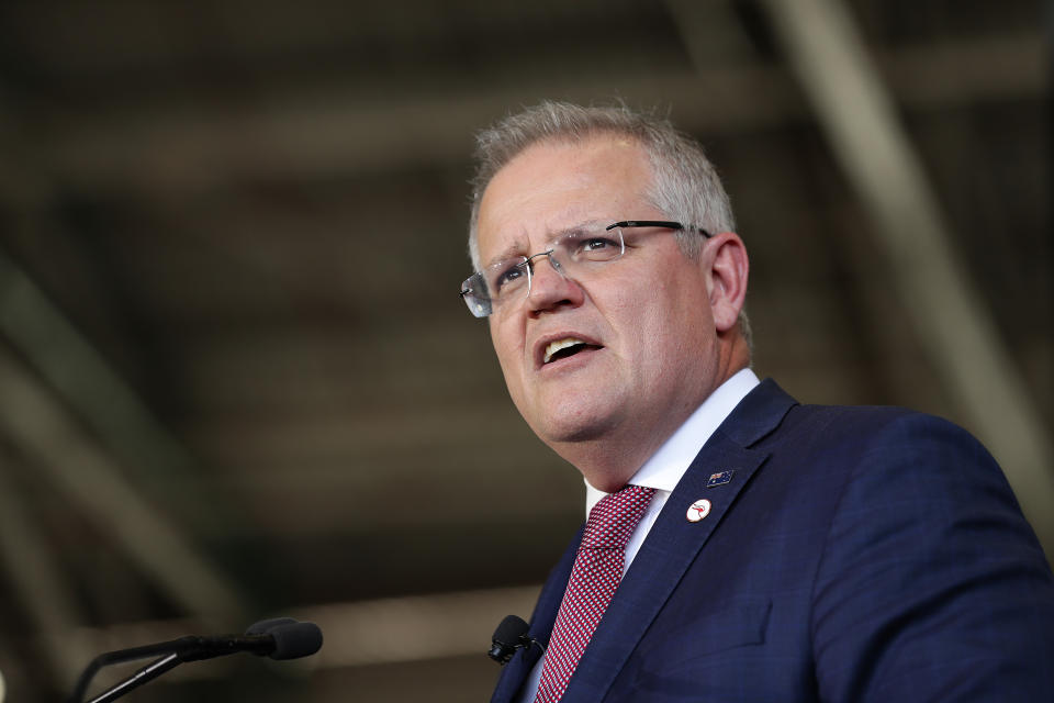 SYDNEY, AUSTRALIA - NOVEMBER 15: Australian Prime Minister Scott Morrison speaks during the Qantas celebration of the arrival of London To Sydney direct flight and centenary event on November 15, 2019 in Sydney, Australia. The centenary celebrations marks Qantas entering its 100th year of service, along with the arrival of Project Sunrise research flight QF7879 direct from London into Sydney. It is only the second time in 30 years that this route has been flown directly. (Photo by Mark Metcalfe/Getty Images)