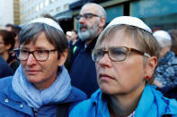 People wear kippas as they attend a demonstration in front of a Jewish synagogue, to denounce an anti-Semitic attack on a young man wearing a kippa in the capital earlier this month, in Berlin, Germany, April 25, 2018. REUTERS/Fabrizio Bensch