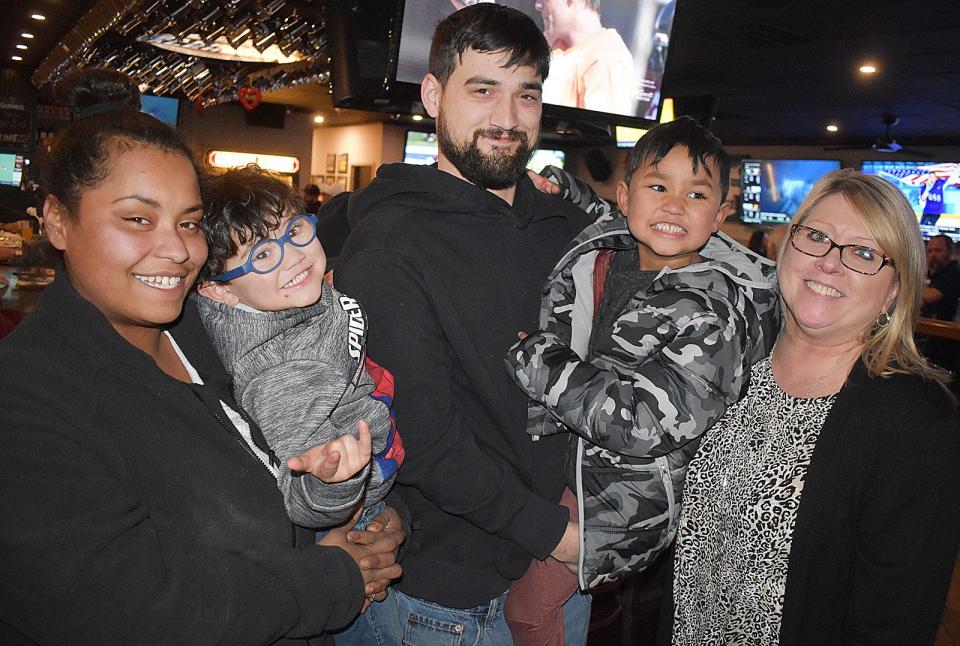 Fire Fund recipients Kayla, Ashton, Dan and Xaviah Wells with Sharon Schoonover Furtado.