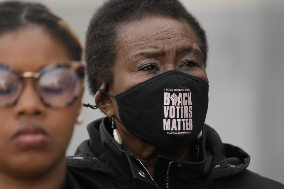 Carol Blackmon, Mississippi Coordinator for Black Voters Matter, joins members of other voting rights groups at a news conference in Jackson, Miss., on Thursday, Dec. 7, 2023, (AP Photo/Rogelio V. Solis)