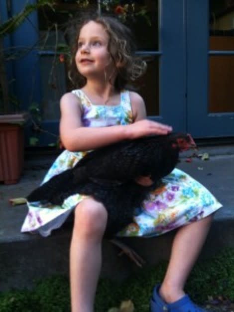 Marci Riseman's daughter Piper snuggles with Tallulah.