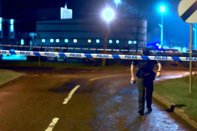PSNI officers at the scene of a shooting in the Killyclogher Road area of Omagh, where a man, a serving police officer, was injured in a shooting incident at a sports complex in Omagh on Wednesday evening. Picture date: Wednesday February 22, 2023.