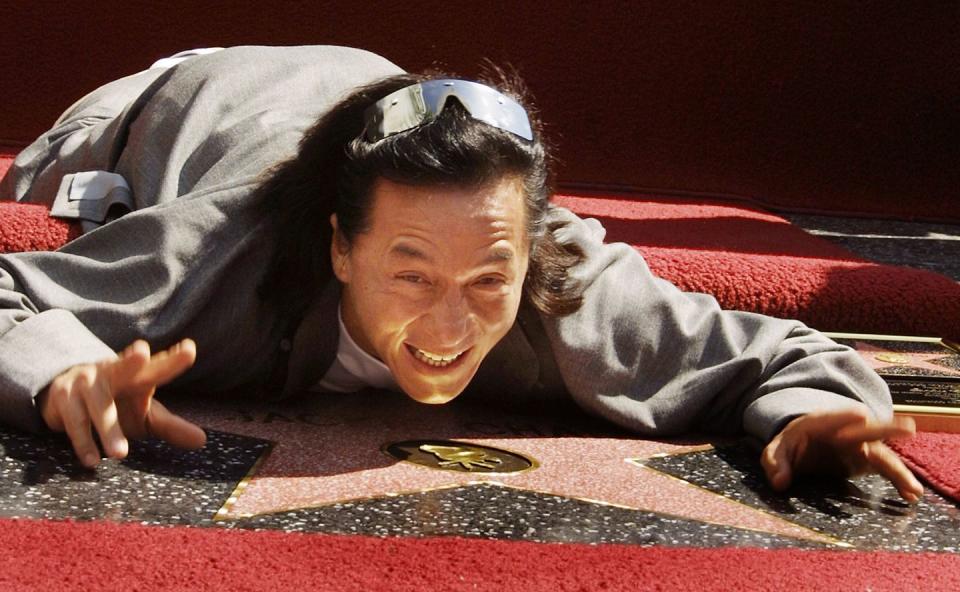 2002: Jackie Chan gets up close and personal with his award