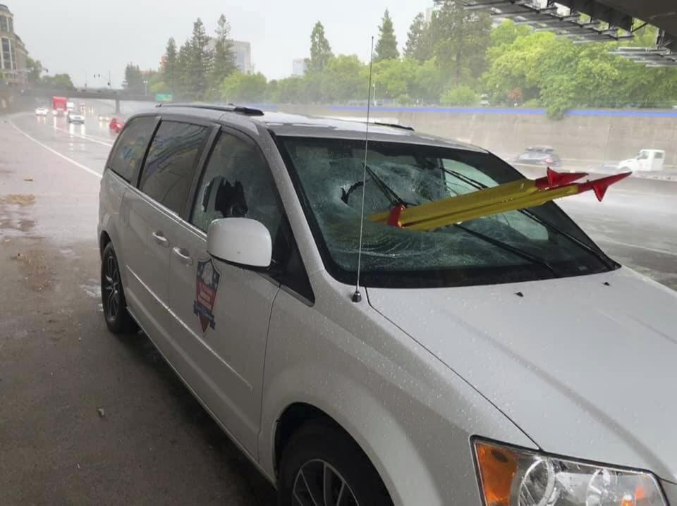 In this Thursday, May 16, 2019, photo released by El Dorado Veterans Resources Transportation/Military Family Support Group (MFSG) shows a stolen tripod from a California Department of Transportation crew, that was dropped from an overpass onto a Sacramento freeway, impaling the lung of a passenger riding on a El Dorado Veterans Resources, van in Sacramento, Calif. The driver of the van, Tim Page, tells KCRA-TV that he was on Interstate 5 Thursday morning when the yellow-and-red tripod smashed through the glass. The passenger survived but with broken ribs and a partially punctured lung. (Tim Page/El Dorado Veterans Resources Transportation/Military Family Support Group via AP)