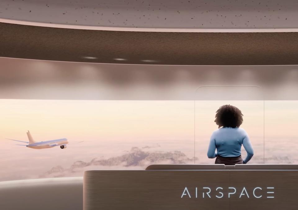 Passenger checking out the view in Airbus' Airspace Cabin Vision 2035+ rendering.