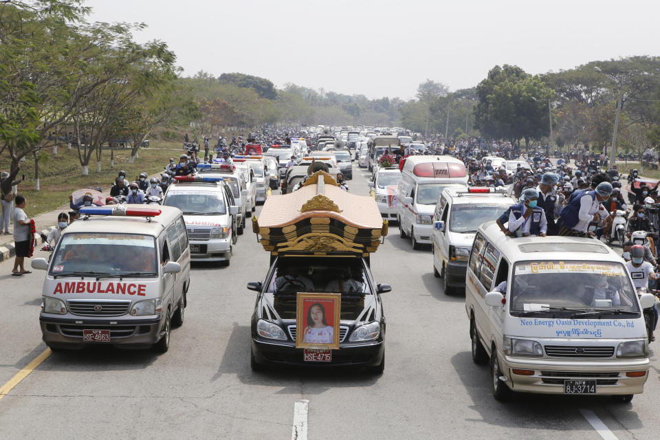 A hearse containing casket of Mya Thwet Thwet Khine travels to the cemetery in Naypyitaw, Myanmar, Sunday, Feb. 21, 2021. Mya Thwet Thwet Khine was the first confirmed death among the many thousands who have taken to the streets to protest the Feb. 1 coup that toppled the elected government of Aung San Suu Kyi. (AP Photo)