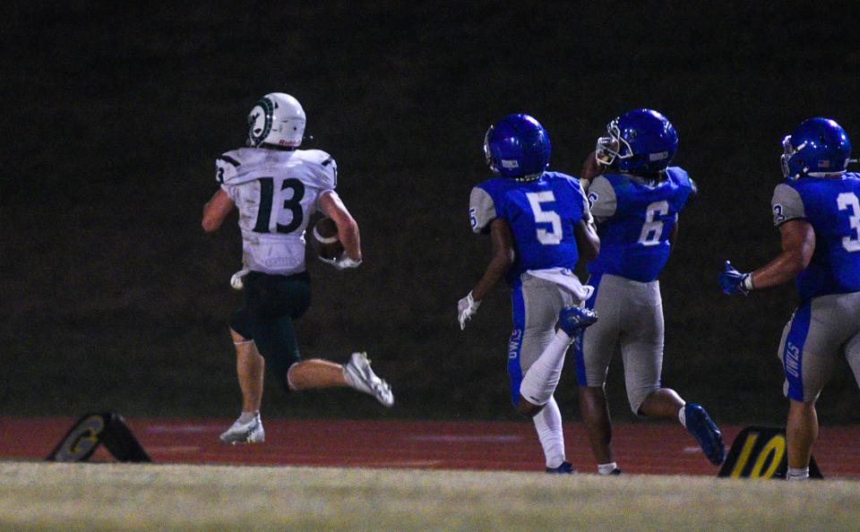 Pennridge's Chase Marshall (13) completes a 75-yard touchdown reception from quarterback Noah Keating against Bensalem.