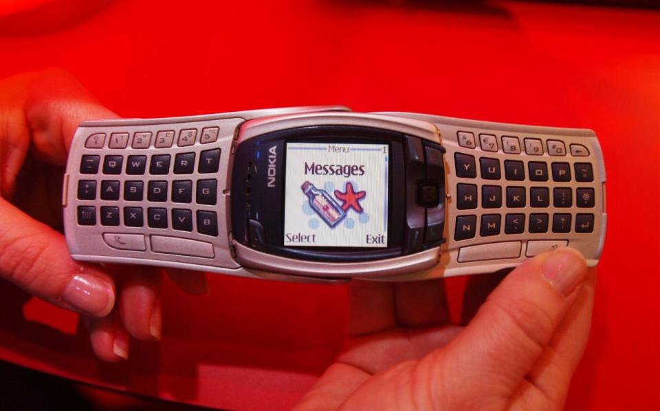 <p>This high-tech phone unfolded to reveal a full keyboard that sort of made it look like a giant watch. In a good way. (David McNew/Getty Images) </p>