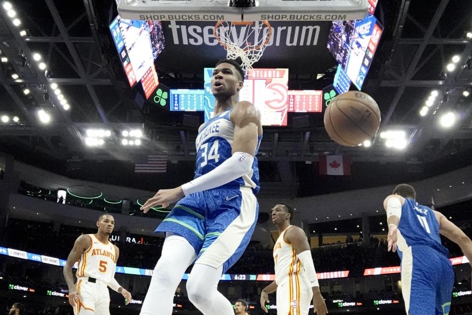 Milwaukee Bucks' Giannis Antetokounmpo reacts after his dunk during the second half of an NBA basketball game against the Atlanta Hawks Saturday, Dec. 2, 2023, in Milwaukee. The Bucks won 132-121. (AP Photo/Morry Gash)