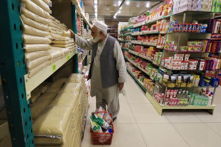 A man shops for grocery items at a store in Peshawar, Pakistan April 3, 2019. REUTERS/Fayaz Aziz/Files