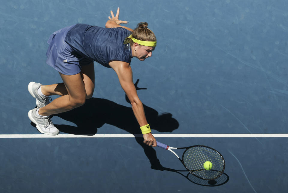 Karolina Muchova of the Czech Republic hits a backhand return to Australia's Ash Barty during their quarterfinal match at the Australian Open tennis championship in Melbourne, Australia, Wednesday, Feb. 17, 2021.(AP Photo/Hamish Blair)