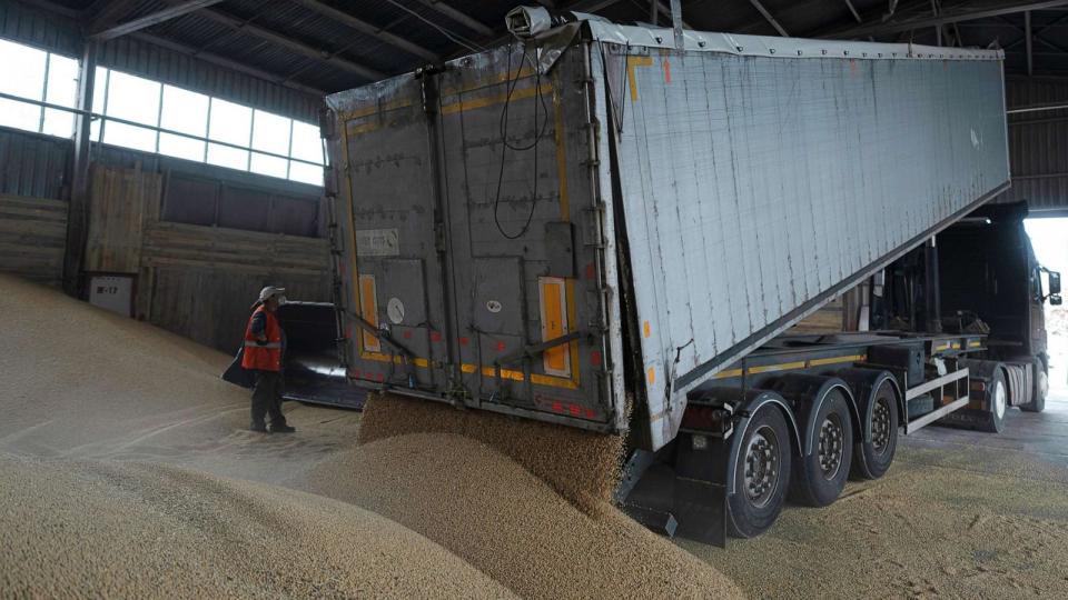 PHOTO: A truck unloads grain at a grain port in Izmail, Ukraine, April 26, 2023. U.S. and European officials have toured Ukraine's southern port of Izmail, a facility that is important in bringing Ukrainian grain exports to the world. (Andrew Kravchenko/AP)