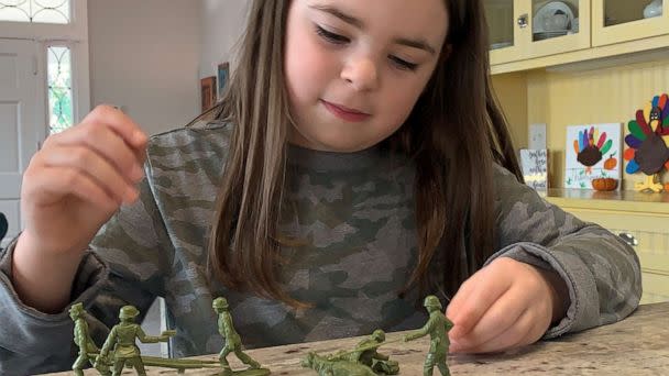PHOTO: Vivian Lord, 7, plays with the plastic green Army women she asked Scranton, Pennsylvania-based BMC Toys to make. (Brittany Lord)