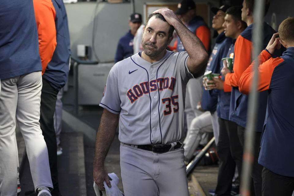 Houston Astros starting pitcher Justin Verlander walks in the dugout after pitching in the sixth inning of the team's baseball game against the Seattle Mariners, Friday, May 27, 2022, in Seattle. (AP Photo/Ted S. Warren)