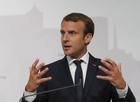 French President Emmanuel Macron speaks to the media at a press conference in Salzburg, Austria, August 23, 2017. REUTERS/Heinz-Peter Bader