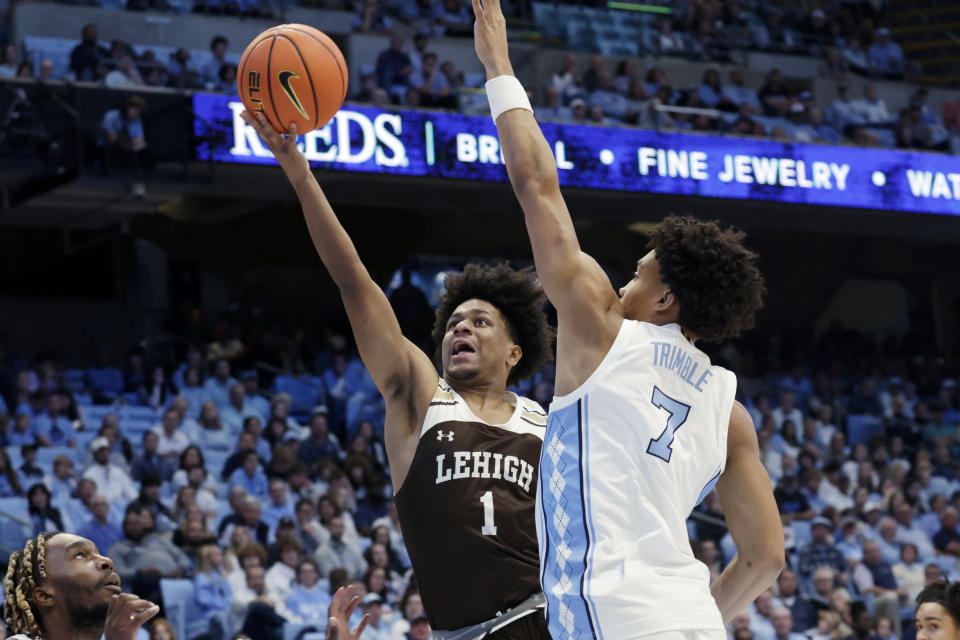 Lehigh guard Nasir Whitlock (1) drives against North Carolina guard Seth Trimble (7) during the second half of an NCAA college basketball game Sunday, Nov. 12, 2023, in Chapel Hill, N.C. (AP Photo/Chris Seward)