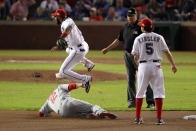 ARLINGTON, TX - OCTOBER 23: Elvis Andrus #1 of the Texas Rangers turns the double play as Lance Berkman #12 of the St. Louis Cardinals slides into second base in the fifth inning during Game Four of the MLB World Series at Rangers Ballpark in Arlington on October 23, 2011 in Arlington, Texas. (Photo by Ezra Shaw/Getty Images)