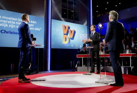 Dutch Prime Minister Mark Rutte (C) of the VVD Liberal party attends a debate in The Hague, Netherlands, March 14, 2017. REUTERS/Robin Van Lonkhuijsen/Pool