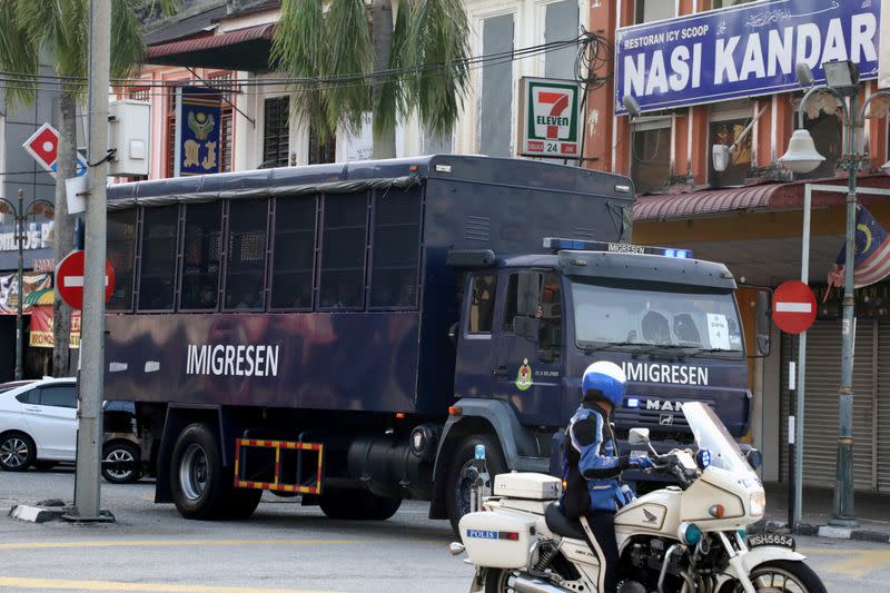 FILE PHOTO: FILE PHOTO: An immigration truck carrying Myanmar migrants to be deported from Malaysia is seen in Lumut